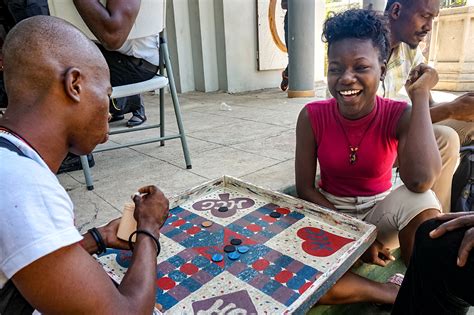Haitians Play Ludo on Game Day