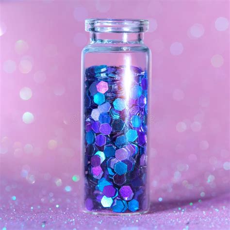 Glitter Product In Transparent Bottle On Pink Sparkling Background