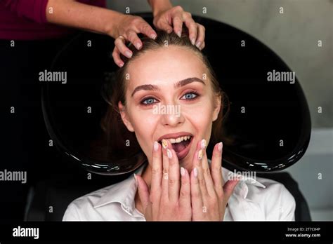 Surprised Blonde Woman Getting Hair Washed Stock Photo Alamy