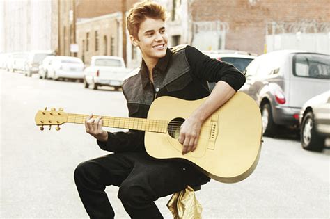 Win an Acoustic Guitar Signed by Justin Bieber