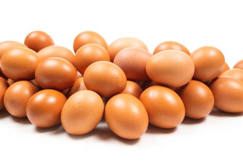 Premium Photo Group Of Brown Eggs Isolated On White