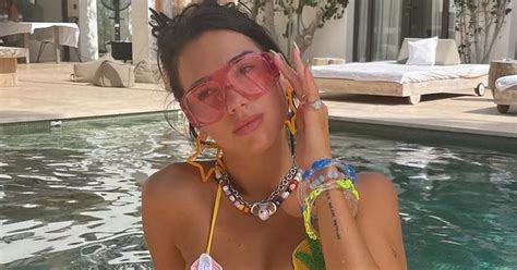 Dua Lipa Flashes Cleavage As She Takes Dip In Tiny Crochet Bikini On