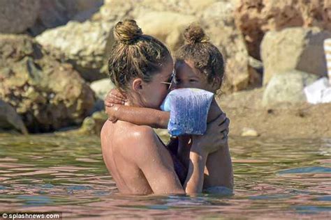 Doutzen Kroes Puts Her Washboard Abs On Display In A Skimpy Bikini