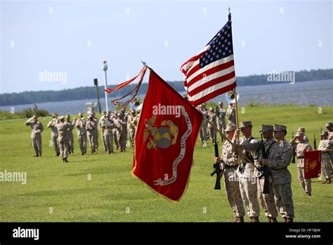 A Marine Corps color guard holds the American flag alongside the Marine ...