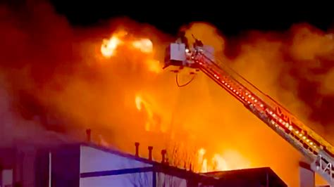 Firefighters battle massive fire that engulfed apartment building in ...