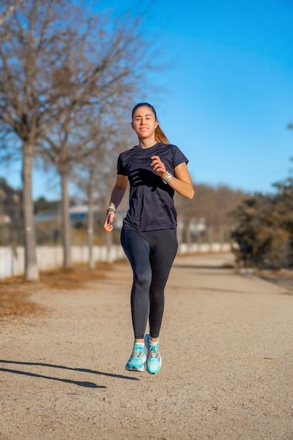 Premium Photo Attractive Young Runner Girl Running Happy And Smiling
