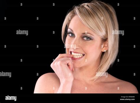 Blonde Woman Biting Her Nails With Nerves Stock Photo Alamy