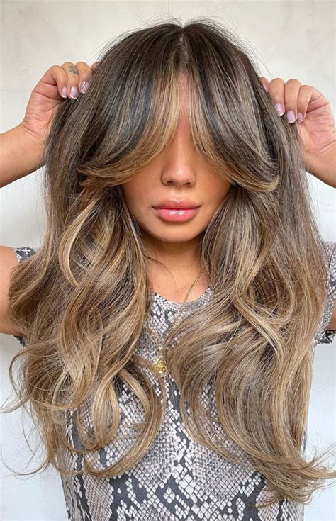 40 Best Layered Haircuts And Hairstyles For 2022 Balayage Flirty Fringe