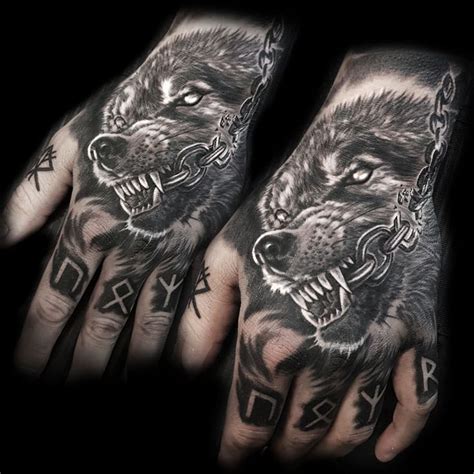 Two Hand Tattoos With Wolfs On Them And Chains Hanging From The Wrist