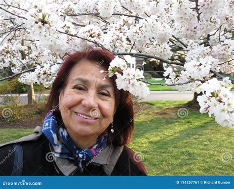 Latina Woman Enjoying The Cherry Blossoms Stock Image Image Of Latina Sunset