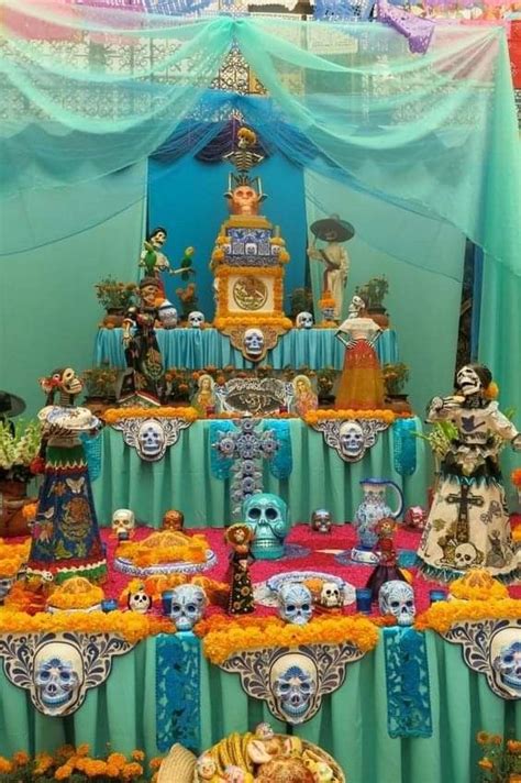 An Elaborate Display With Skulls Flowers And Other Decorative Items In