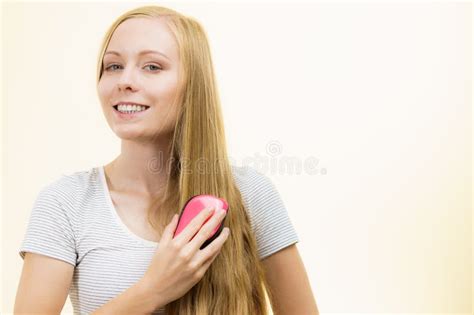 Blonde Girl Brushing Her Long Hair Stock Image Image Of Smooth Comb 283688151