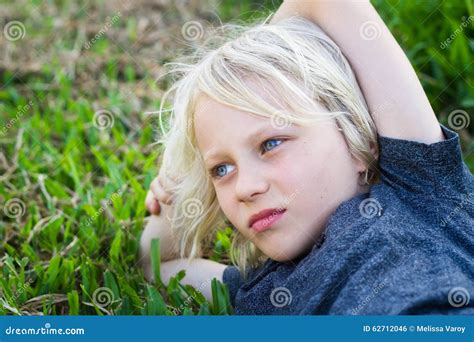 Sad child alone in park stock photo. Image of green, healthy - 62712046