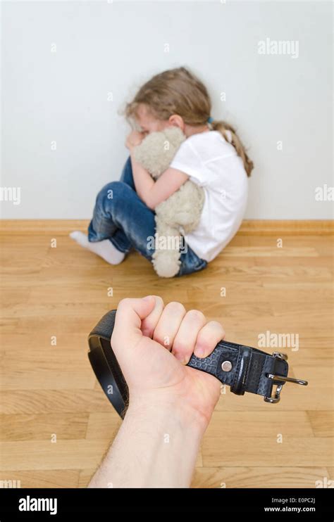 Little Girl Crying In The Corner Domestic Violence Concept Stock Photo