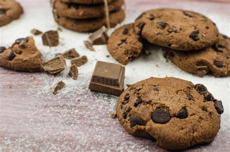 Freshly Baked Chocolate Chip Cookies On Rustic Wooden Table Stock Photo