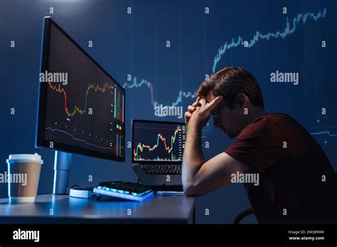 Side View Of Depressed Thoughtful Male Crypto Investor Holding Head In