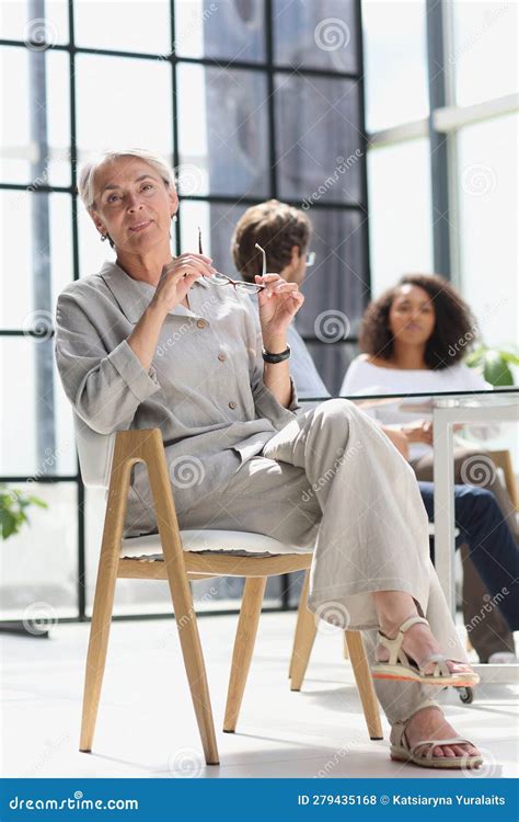 Mature Woman Sitting With Laptop Looking At Camera Stock Photo Image Of Lady Elder