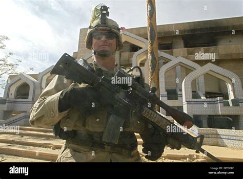 U.S. Army's soldier from 4th Infantry Division (Task Force Ironhorse), guards the home of Saddam ...