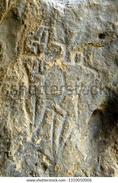 Naked Man With Erected Penis And Woman Prehistoric Petroglyphs Rock Painting Are Included