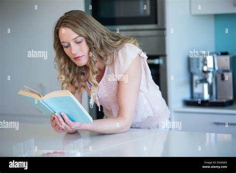 Pretty Blonde Reading A Book Stock Photo Alamy