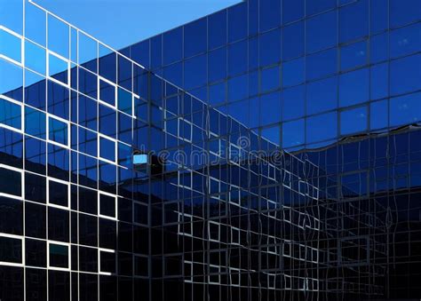 Two Modern Glass Facades That Intersect And Reflect Themselves Stock Image Image Of