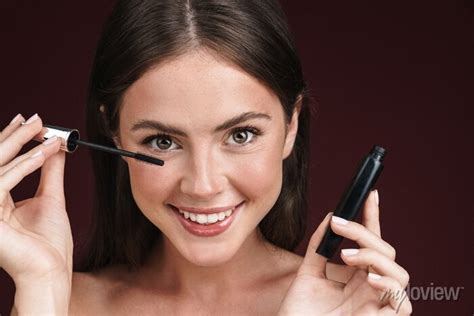 Image Of Smiling Half Naked Woman Looking At Camera And Using Wall Stickers Smiling Pleased