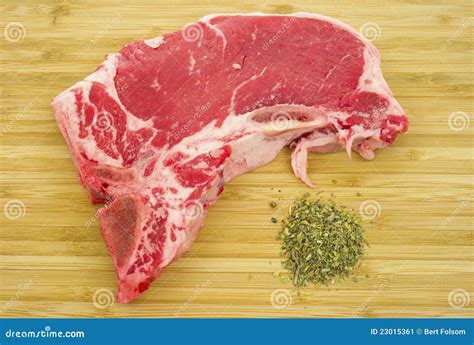 T-bone Steak on Cutting Board with Seasoning Stock Image - Image of
