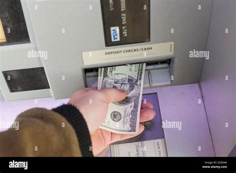 Man Depositing Money Into Atm Stock Photo Alamy