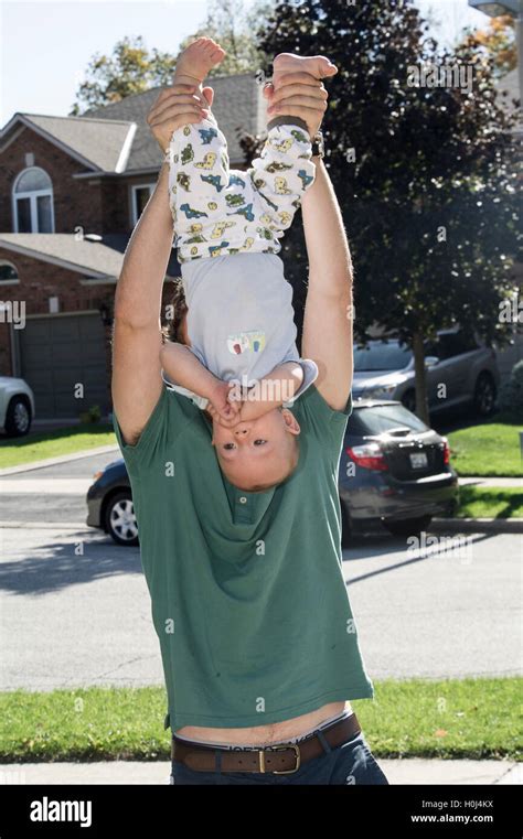 Father Holding Child Upside Down Hi Res Stock Photography And Images