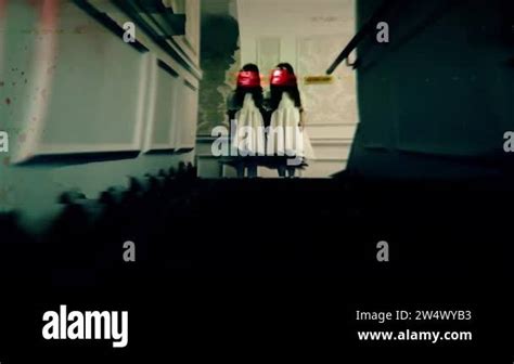 creepy twins  red distorted faces standing  hotel stairs