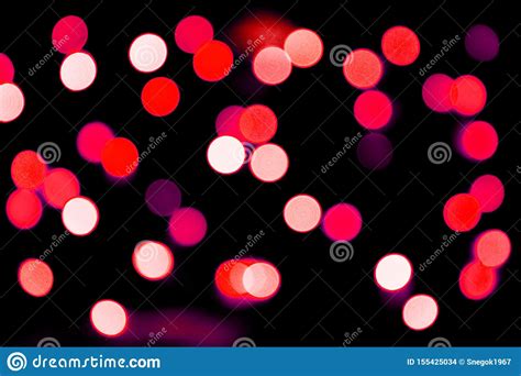 Unfocused Abstract Red Bokeh On Black Background Defocused And Blurred