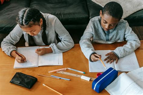 focused children  homework  table  stock photo