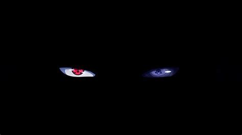 Two Blue Eyes In The Dark With One Red Eye