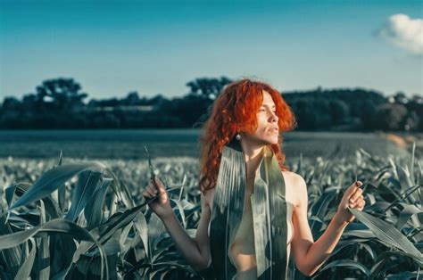 Premium Photo Portrait Of A Naked Red Woman In A Field Among Corn Leaves