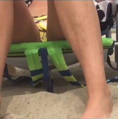 Casually Wetting Her Bikini While Sunbathing ThisVid