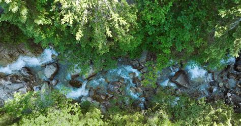 top  view  mountain river flowing  large stones