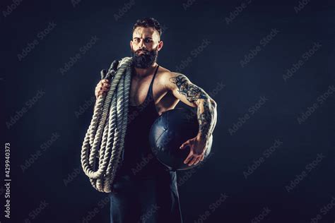 Muscular Man Working Out With Heavy Rope Photo Of Man With Naked Torso Strength And Motivation
