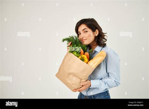Brunette With A Package Of Groceries Healthy Food Vegetables Supermarket Stock Photo Alamy