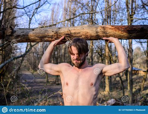 Man Brutal Strong Attractive Guy Collecting Wood In Forest Lumberjack Or Woodman Naked Muscular