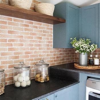 Blue Laundry Room Cabinets With Black And White Cement Floor Tiles