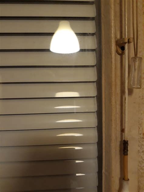 These blinds are inside the window. : r/mildlyinteresting