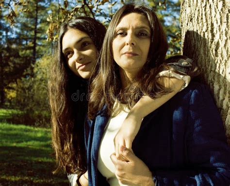 Mature Real Mother With Daughter Outside Autumn Fall In Park Stock