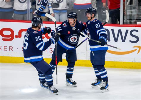 Winnipeg Jets' Josh Morrissey and Mark Scheifele "Game-Time Decisions