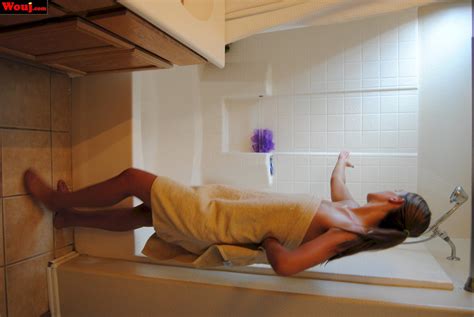 Desirable Brunette Girl Posing In Black Lingerie On The Couch Photos