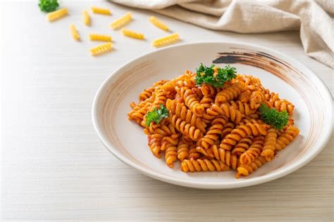 Premium Photo Spiral Or Spirali Pasta With Tomato Sauce And Parsley