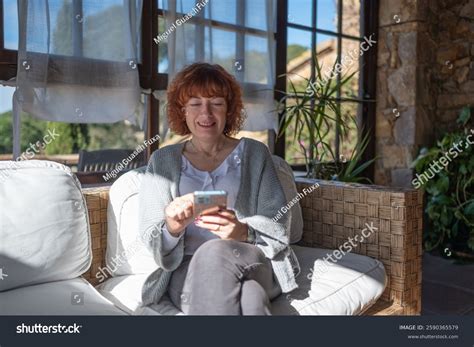 Redhead Mature Woman Using Mobile Phone Stock Photo 2590365579 Shutterstock