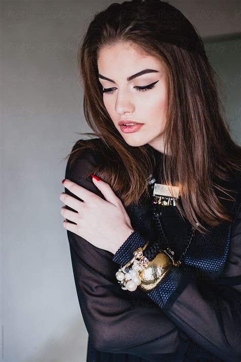 Portraits Of A Beautiful Young Woman In A Vintage Black Dress By