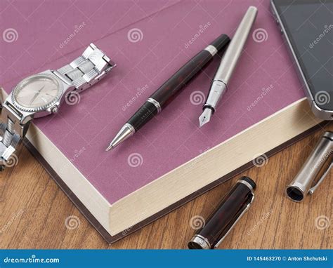 Notepad Pen And Watches On The Wood Desk Stock Photo Image Of