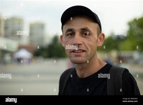 Guy In Black Clothes Man Smiles Portrait Of Man In Summer Walk