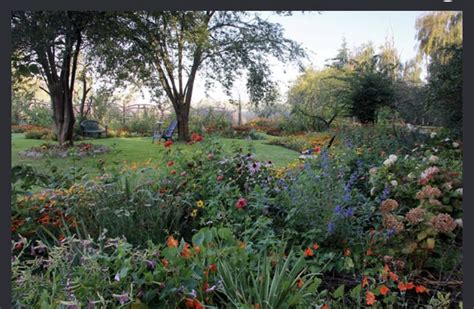 the garden is full of colorful flowers and trees